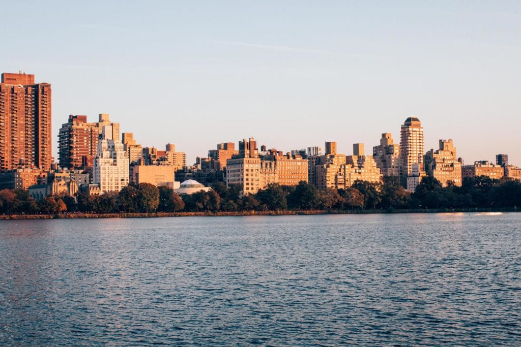 view of New York City skyline from the Jacqueline Keneddy Onassis Reservoir in Central Park